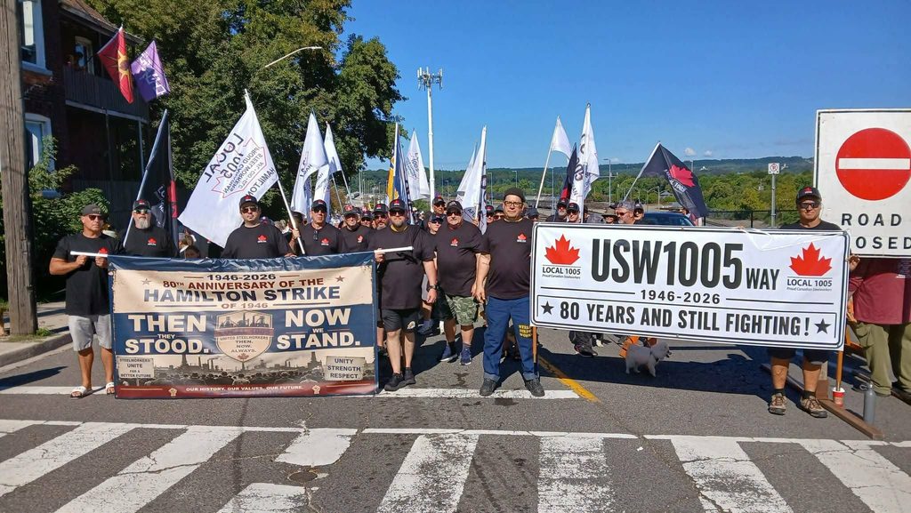 1005 members in front of signs at Labour Day parade
